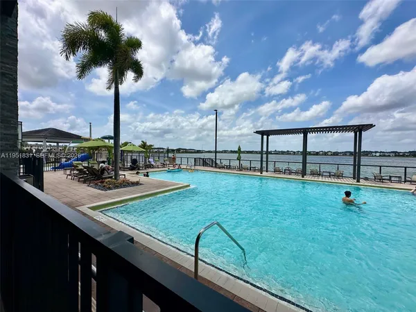 a view of swimming pool from a balcony