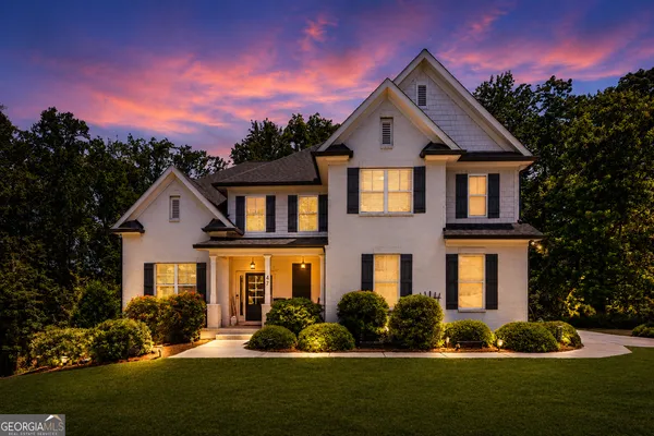a front view of a house with a yard