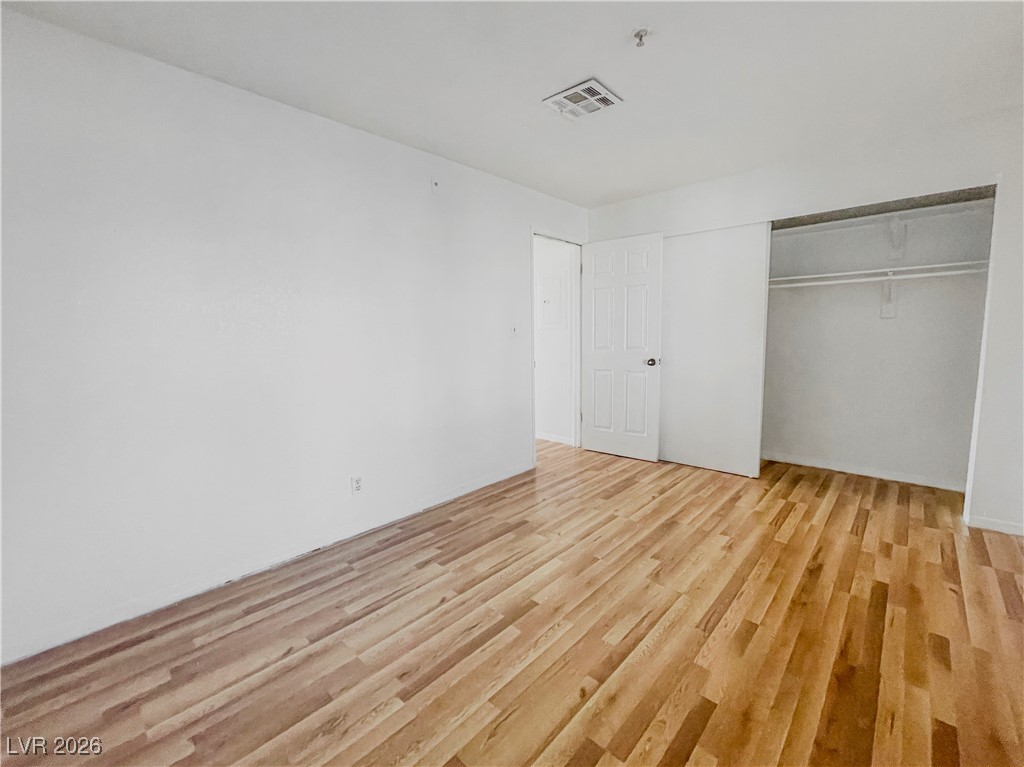 2044 Mesquite Lane, Unit 202 Laughlin, NV 89029 - Photo 26 of 47 Secondary bedroom featuring light wood-type flooring, visible vents, and a closet