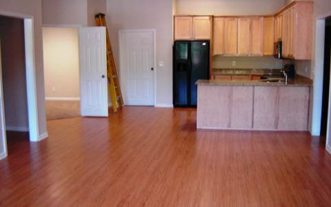 500 East Main Street, Unit 308 Blue Ridge, GA 30513 - Photo 4 of 12 a view of a kitchen with wooden floor and a window