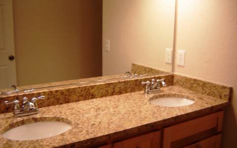 500 East Main Street, Unit 308 Blue Ridge, GA 30513 - Photo 8 of 12 a bathroom with a granite countertop sink and a mirror