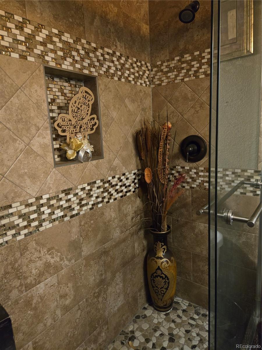 633 South Stuart Street Denver, CO 80219 - Photo 13 of 28 a bathroom with shower
