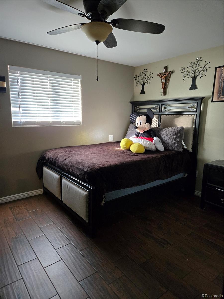 633 South Stuart Street Denver, CO 80219 - Photo 14 of 28 a bed room with a bed and a window