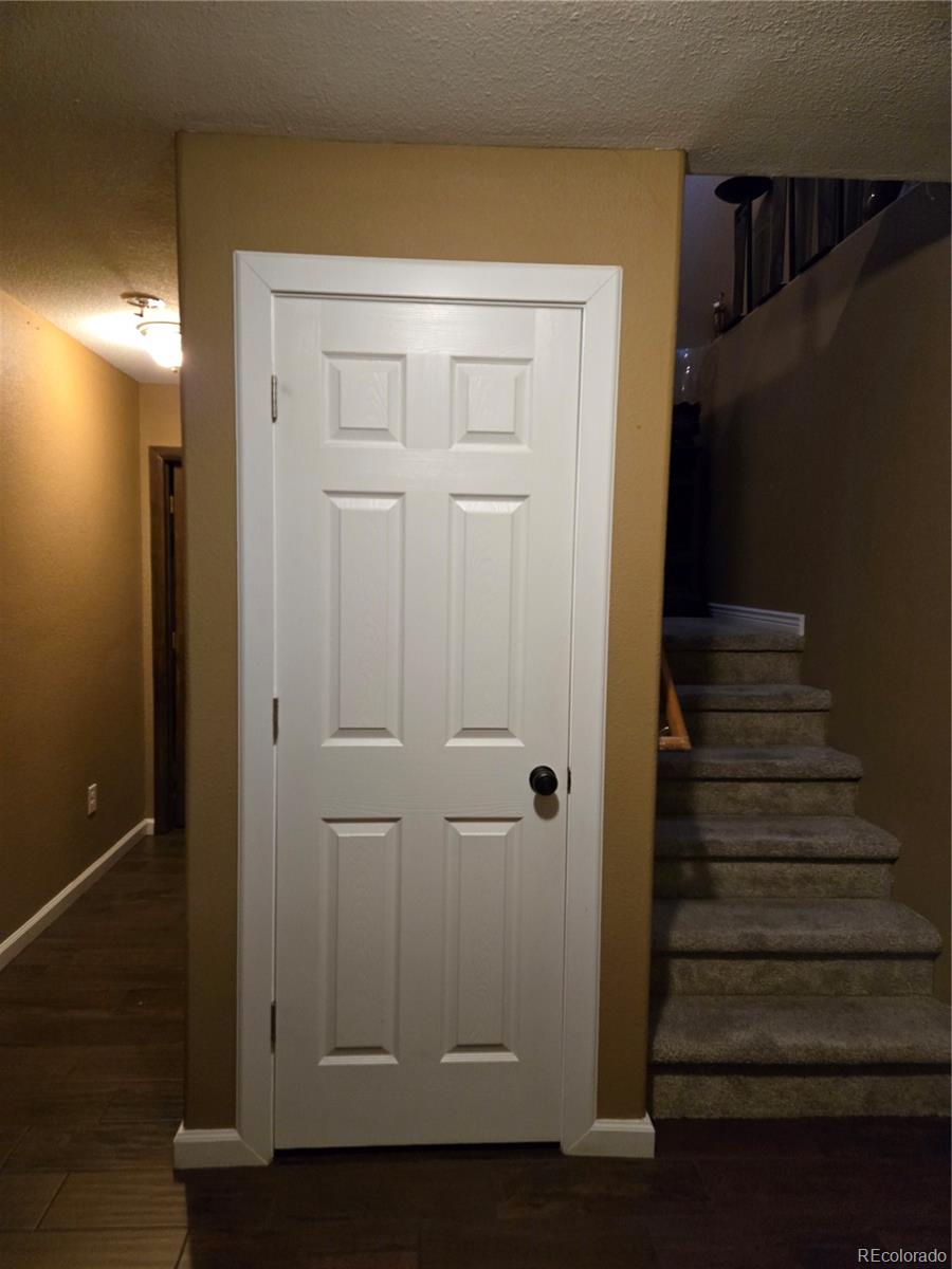633 South Stuart Street Denver, CO 80219 - Photo 19 of 28 a view of entryway with wooden floor