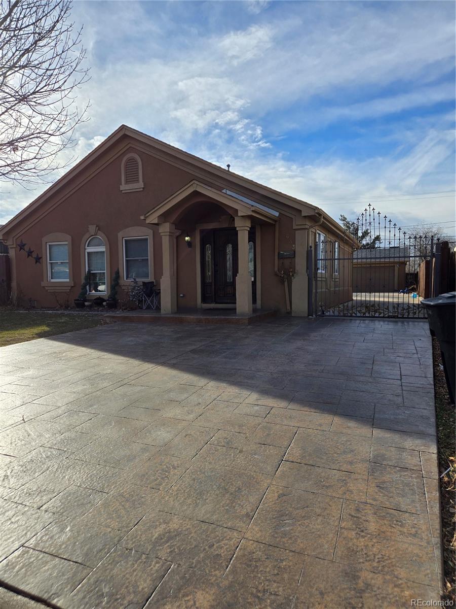 633 South Stuart Street Denver, CO 80219 - Photo 2 of 28 a front view of a house with a yard