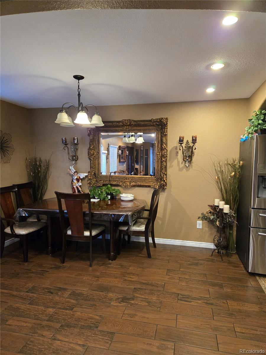633 South Stuart Street Denver, CO 80219 - Photo 6 of 28 a view of a dining room with furniture