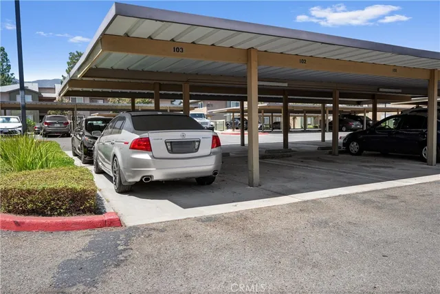 an aerial view of multiple houses with a yard