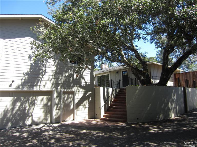 a view of a house with a tree