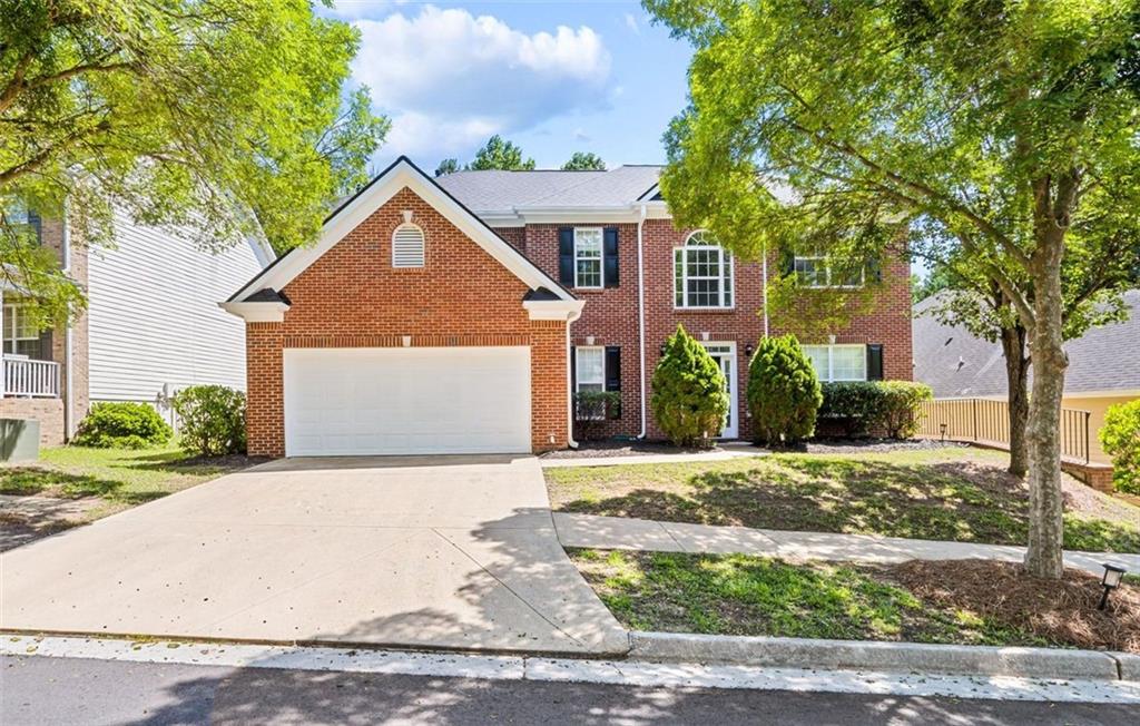 473 Greyhawk Way Fairburn, GA 30213 - Photo 1 of 34 a front view of a house with a yard and garage
