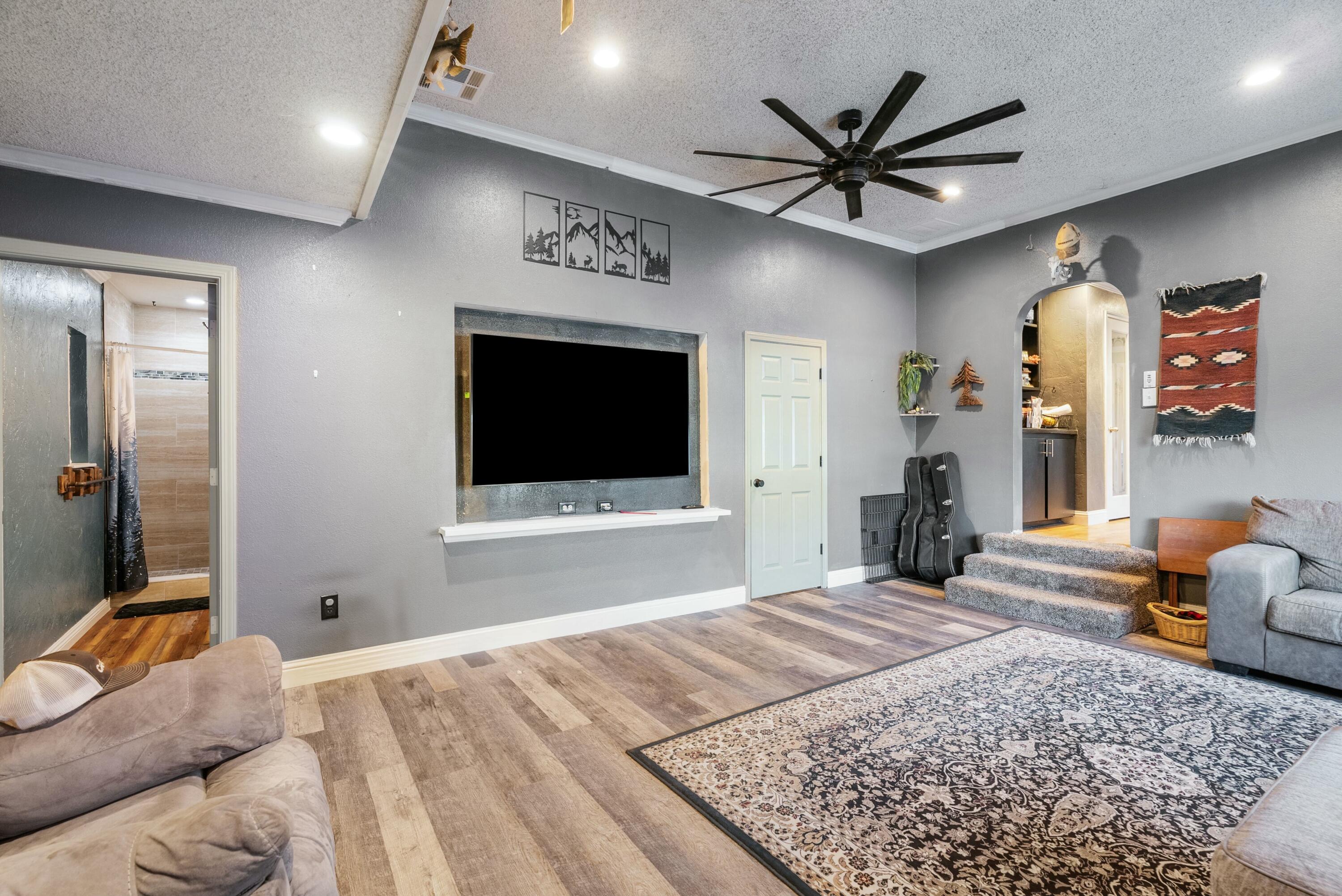 3145 Quartz Hill Road Redding, CA 96003 - Photo 13 of 32 a bedroom with a bed and a flat screen tv