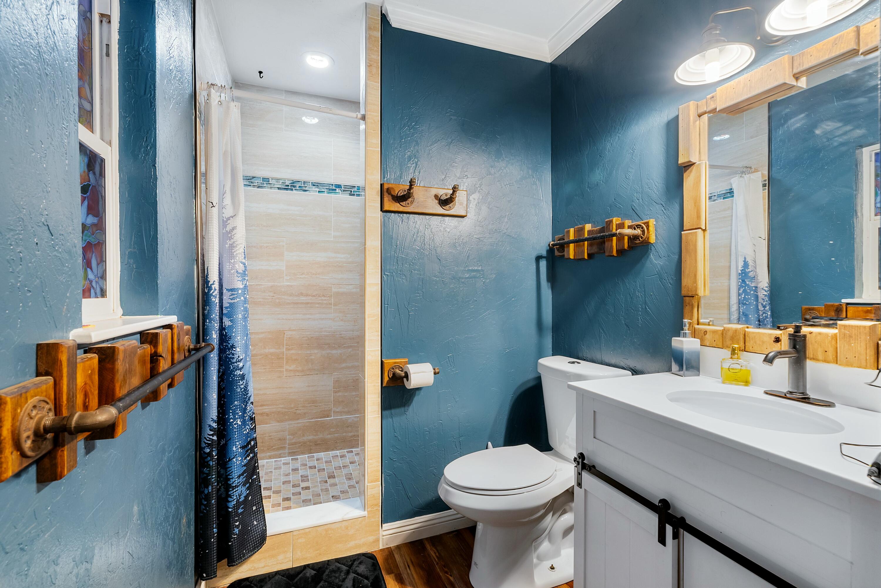 3145 Quartz Hill Road Redding, CA 96003 - Photo 17 of 32 a bathroom with a sink toilet and shower