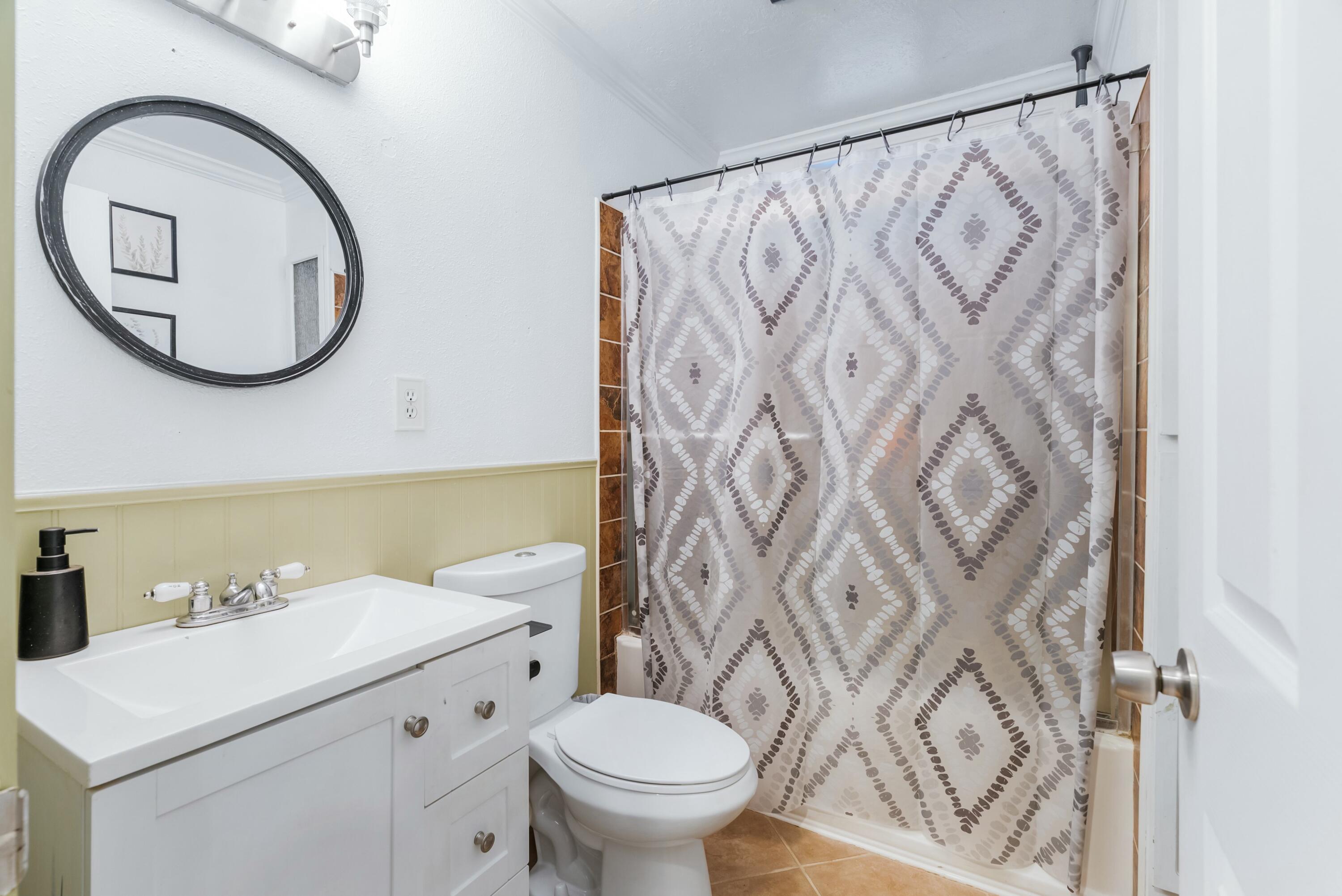 3145 Quartz Hill Road Redding, CA 96003 - Photo 20 of 32 a bathroom with a toilet sink and mirror