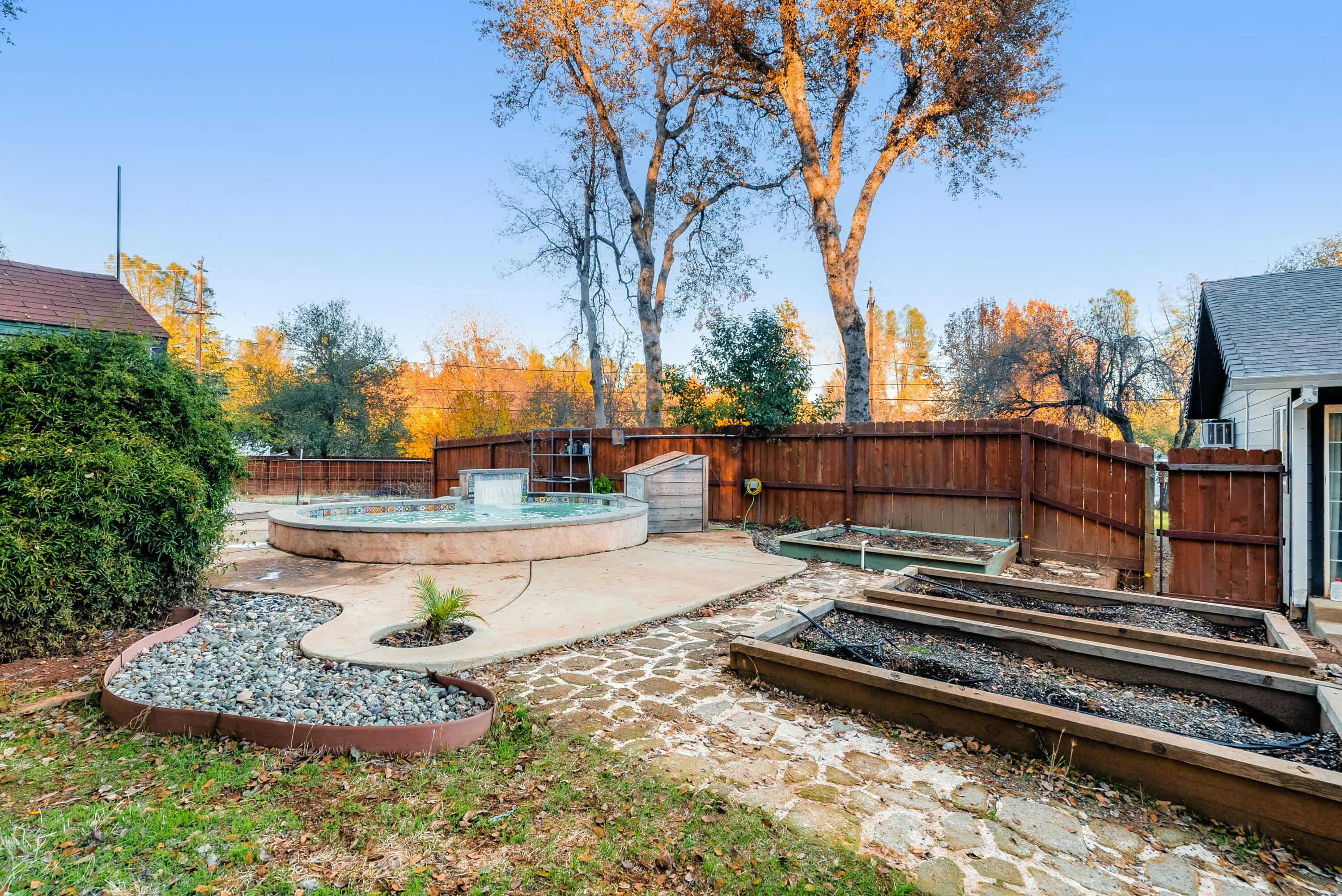 3145 Quartz Hill Road Redding, CA 96003 - Photo 25 of 32 a view of a backyard with wooden fence
