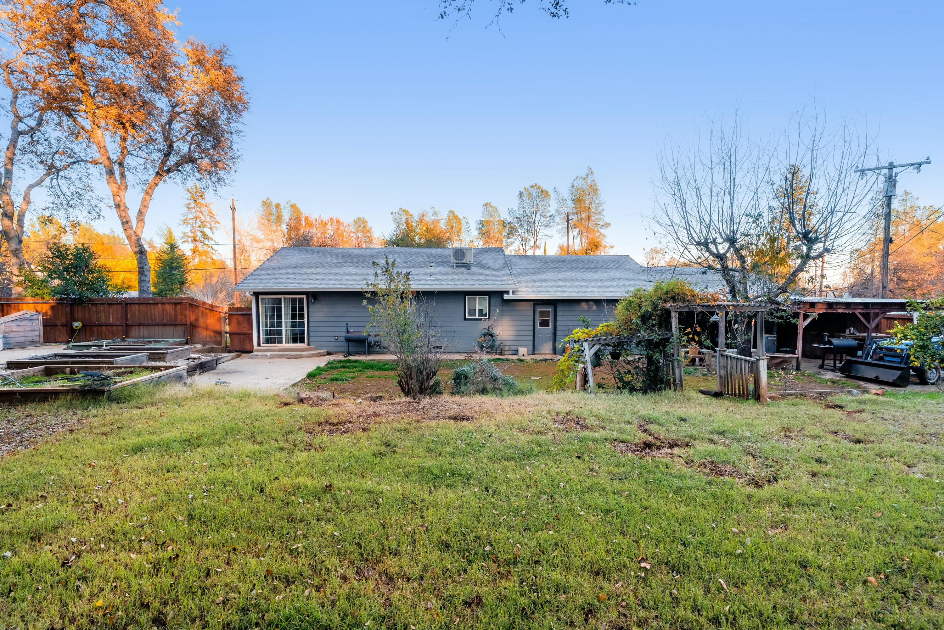 3145 Quartz Hill Road Redding, CA 96003 - Photo 28 of 32 a view of a house with swimming pool and sitting area