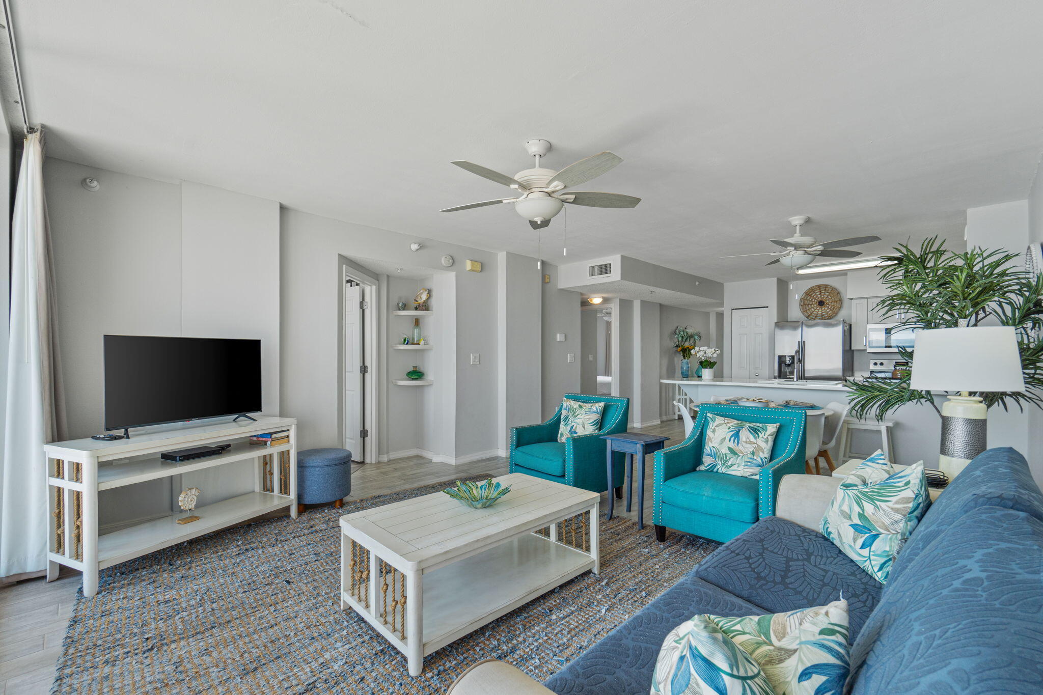 520 Santa Rosa Boulevard, Unit 404 Fort Walton Beach, FL 32548 - Photo 11 of 44 a living room with furniture and a flat screen tv