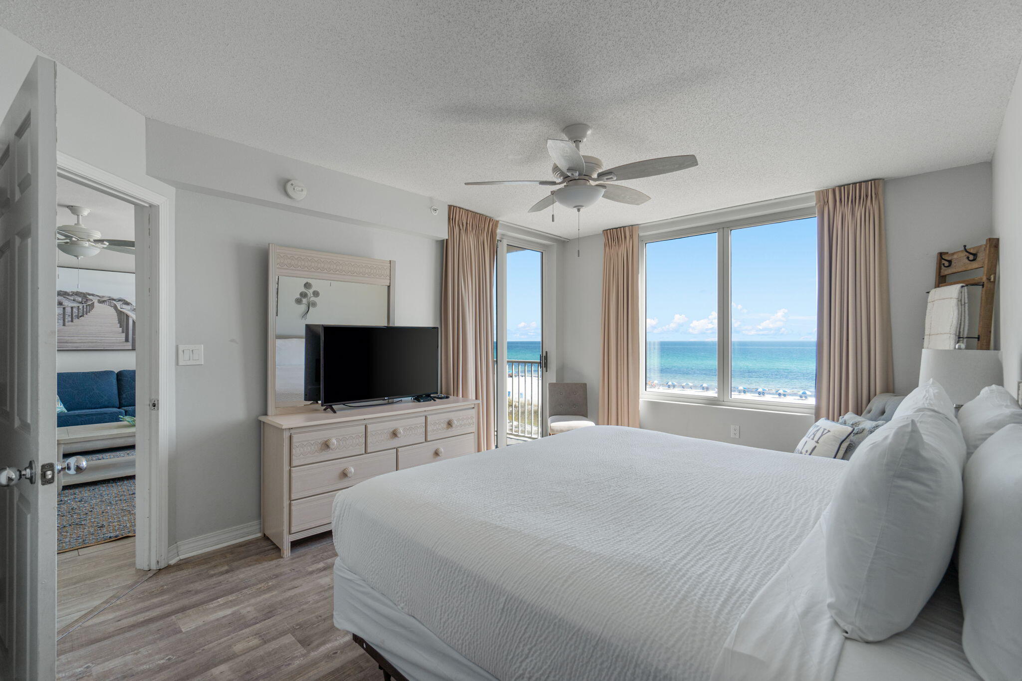520 Santa Rosa Boulevard, Unit 404 Fort Walton Beach, FL 32548 - Photo 12 of 44 a bedroom with a bed window and a flat screen tv