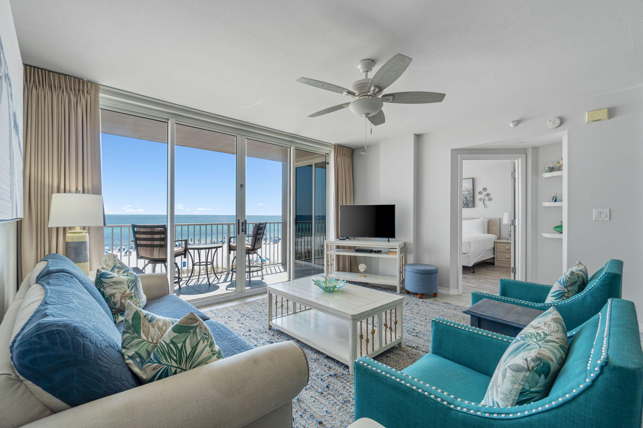 520 Santa Rosa Boulevard, Unit 404 Fort Walton Beach, FL 32548 - Photo 2 of 44 a living room with furniture and a flat screen tv