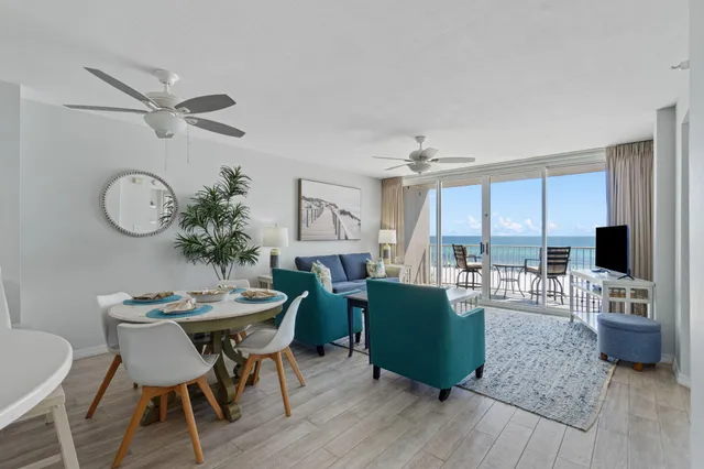a view of a dining room with furniture and wooden floor
