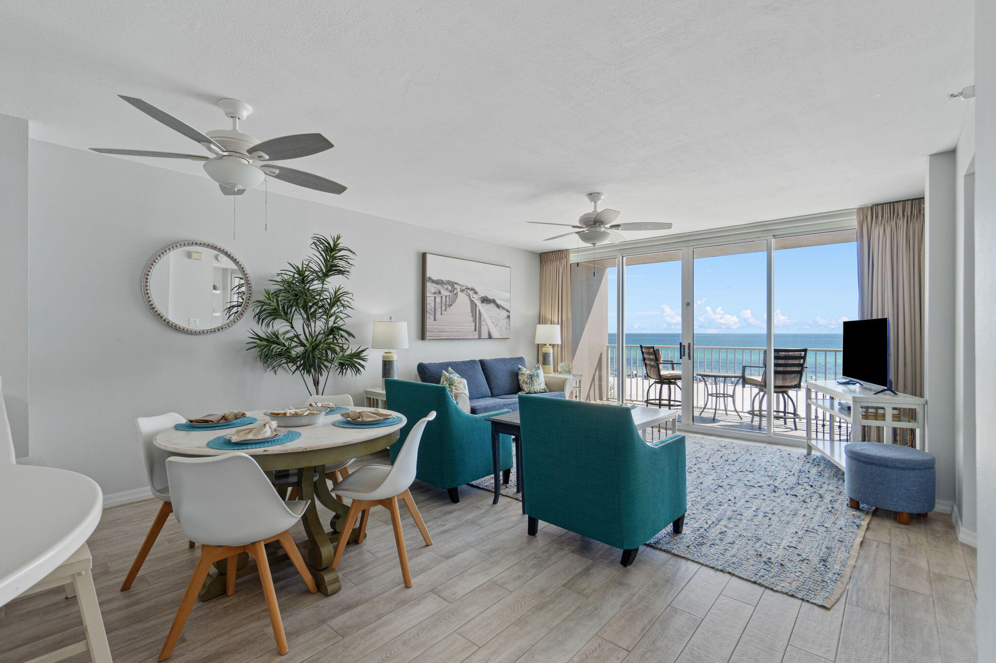 520 Santa Rosa Boulevard, Unit 404 Fort Walton Beach, FL 32548 - Photo 3 of 44 a view of a dining room with furniture and wooden floor