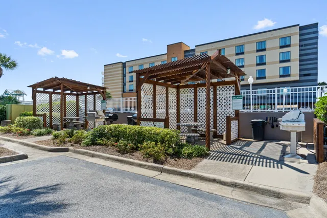 a view of a chair and tables in the patio