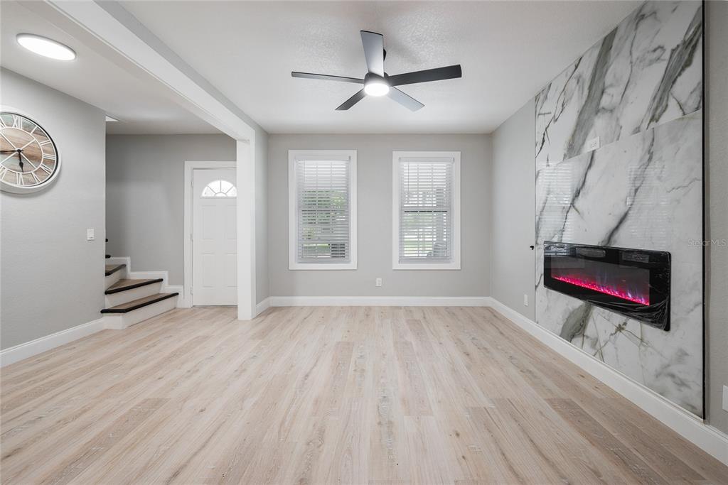 922 Delaware Avenue St. Cloud, FL 34769 - Photo 5 of 31 wooden floor in an empty room with a window