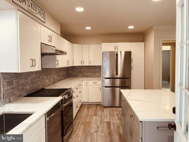 1016 Windrush Lane, Unit 25 Sandy Spring, MD 20860 - Photo 6 of 37 Modern kitchen with sleek finishes.