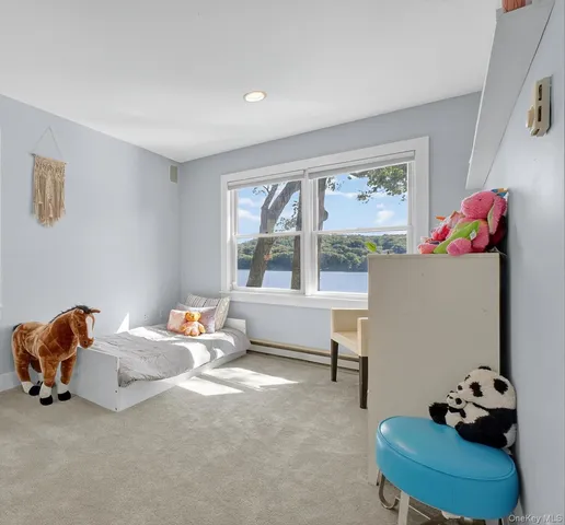 a bedroom with bed and a window