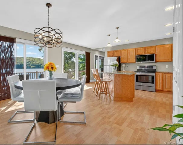 a view of a dining room with furniture window and outside view
