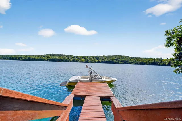a view of a lake with outdoor seating and lake