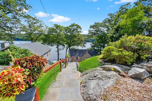 a view of a street with flower plants