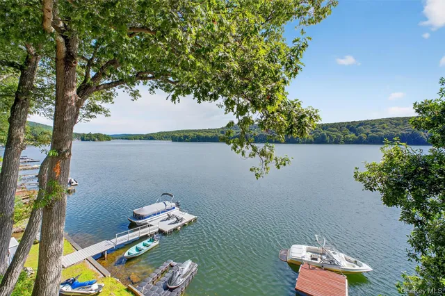 an aerial view of a house with a lake view