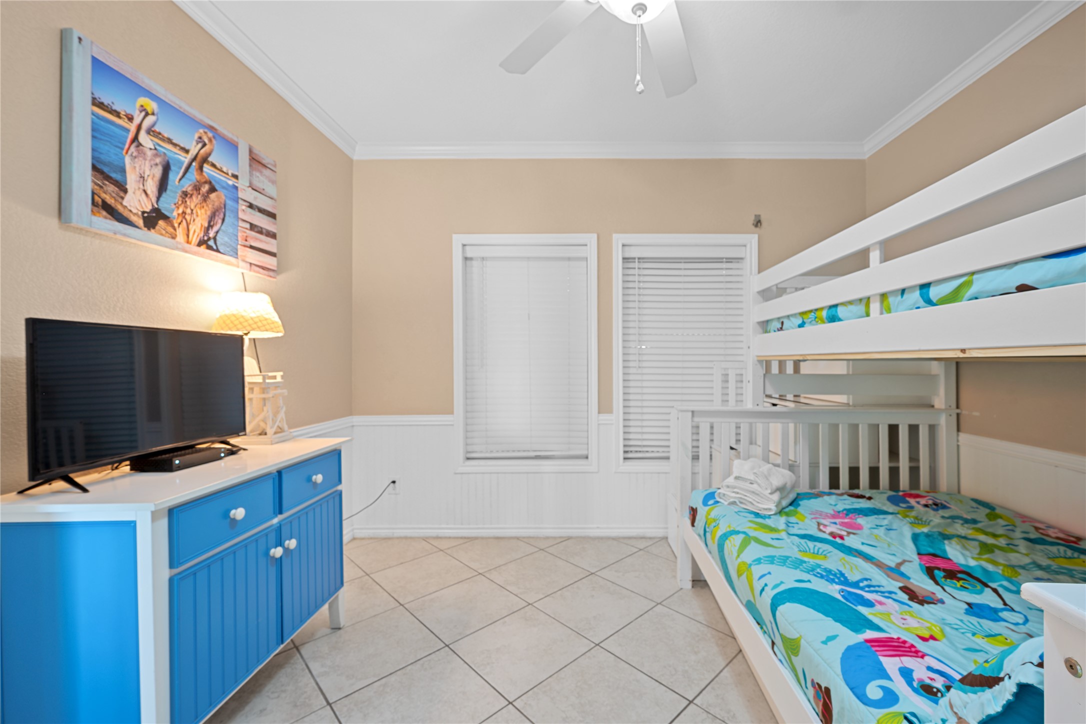 740 Copano Cove Road Rockport, TX 78382 - Photo 30 of 35 a bedroom with furniture and a flat screen tv