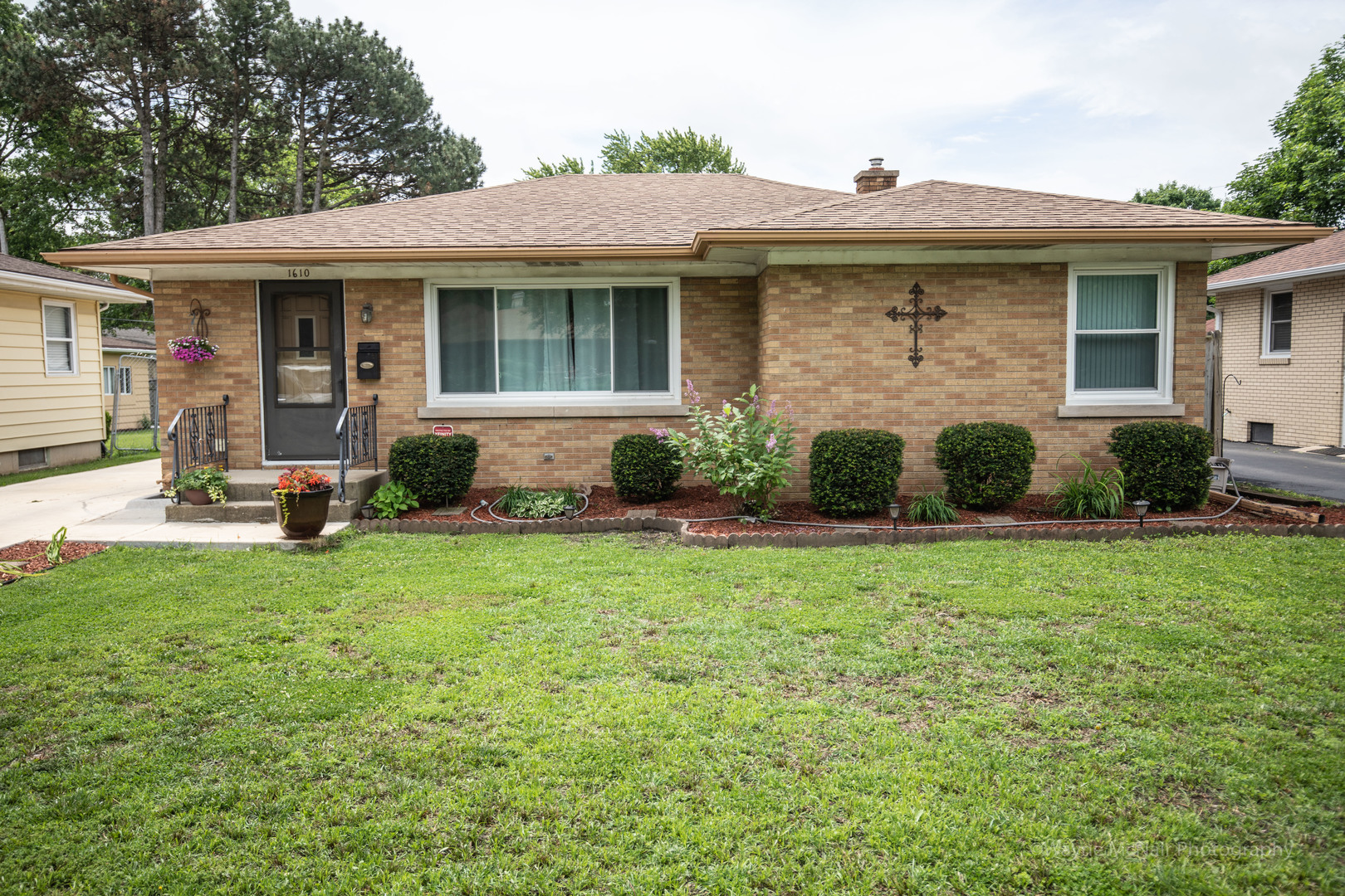 1610 Black Road Joliet, IL 60435 - Photo 1 of 25 a view of a house with backyard sitting area and garden