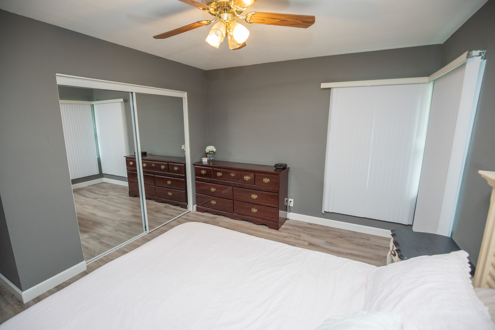 1610 Black Road Joliet, IL 60435 - Photo 12 of 25 a bedroom with a bed and a chandelier