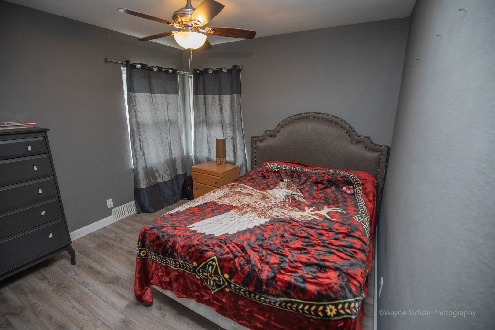 1610 Black Road Joliet, IL 60435 - Photo 14 of 25 a bedroom with a bed and a chandelier
