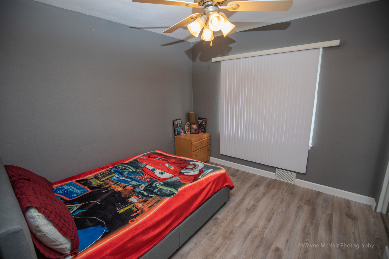 1610 Black Road Joliet, IL 60435 - Photo 15 of 25 a bedroom with a bed and a chandelier