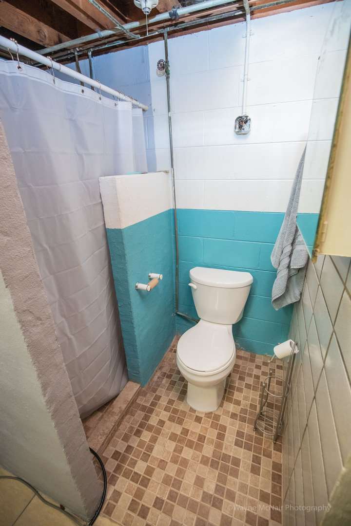 1610 Black Road Joliet, IL 60435 - Photo 19 of 25 a bathroom with a toilet and a sink