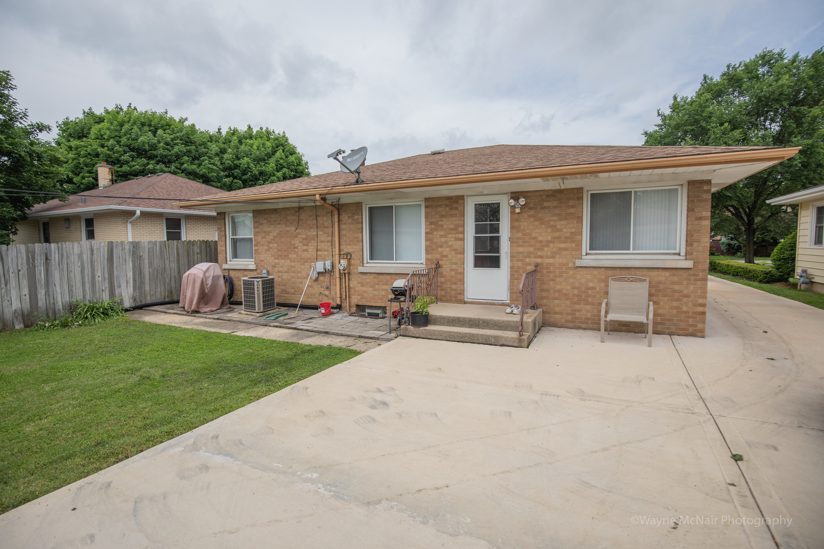 1610 Black Road Joliet, IL 60435 - Photo 22 of 25 a view of a house with backyard sitting area and garden