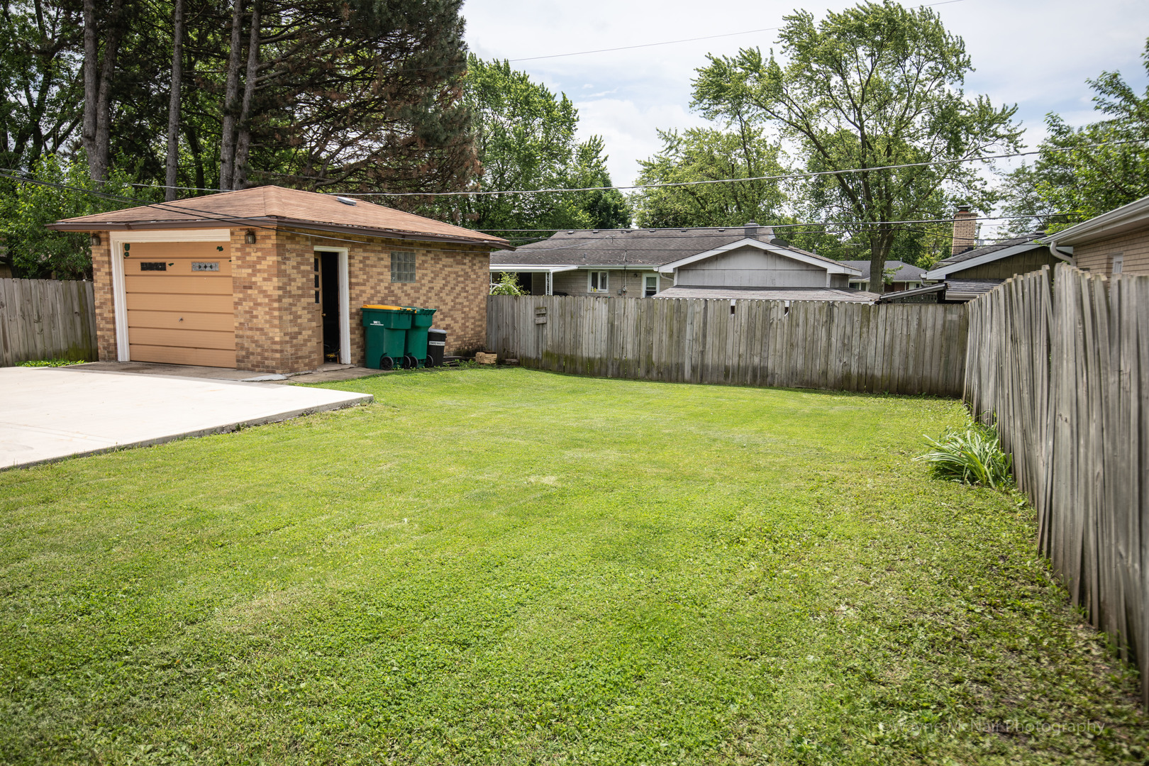 1610 Black Road Joliet, IL 60435 - Photo 25 of 25 a front view of a house with a yard and trees