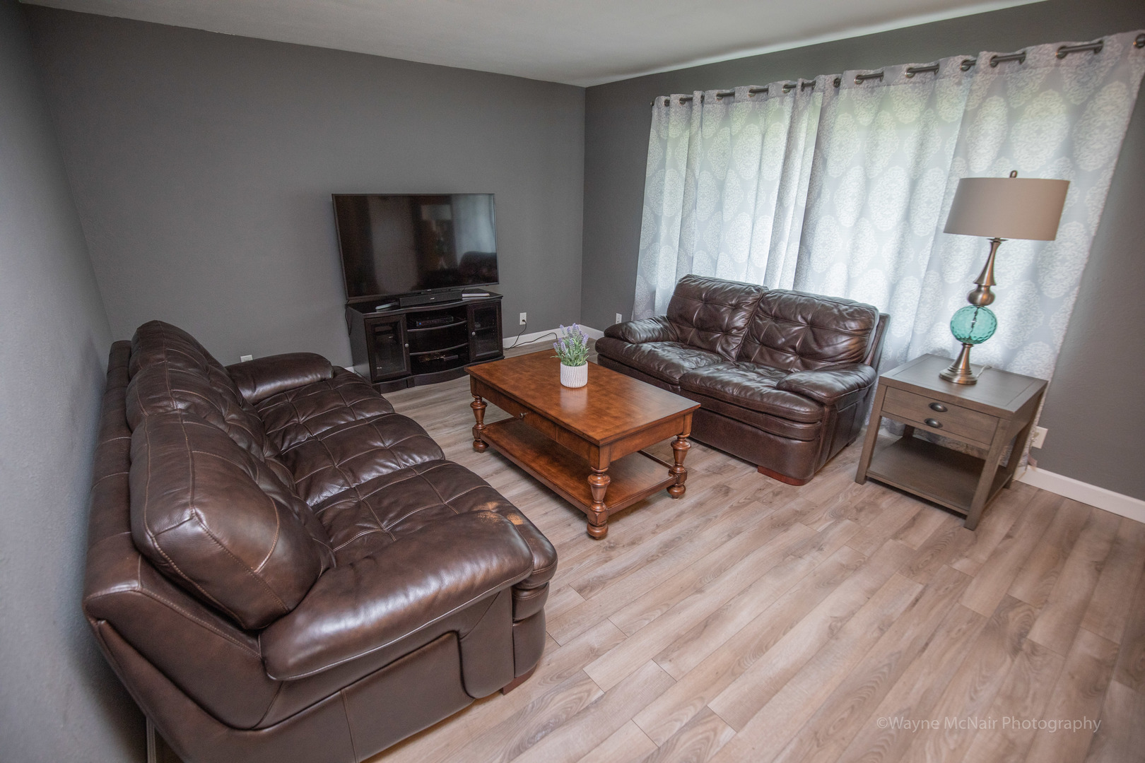 1610 Black Road Joliet, IL 60435 - Photo 5 of 25 a living room with furniture and a flat screen tv