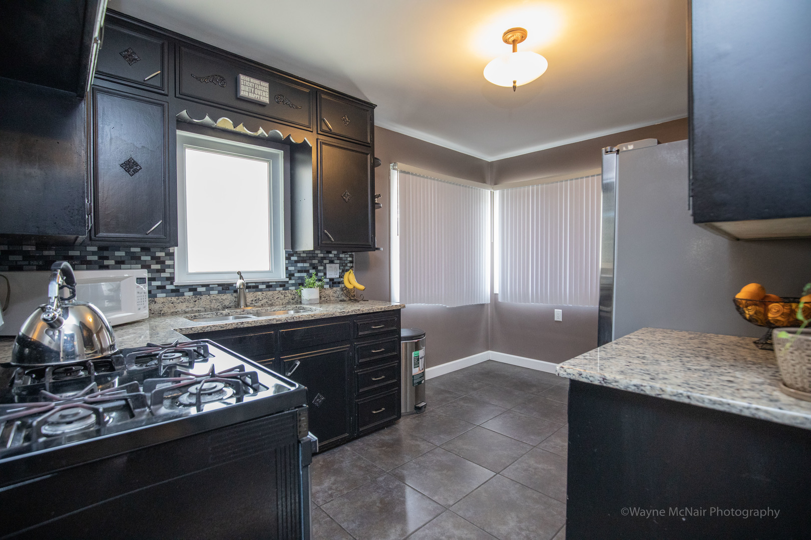 1610 Black Road Joliet, IL 60435 - Photo 8 of 25 a kitchen with a stove and a sink