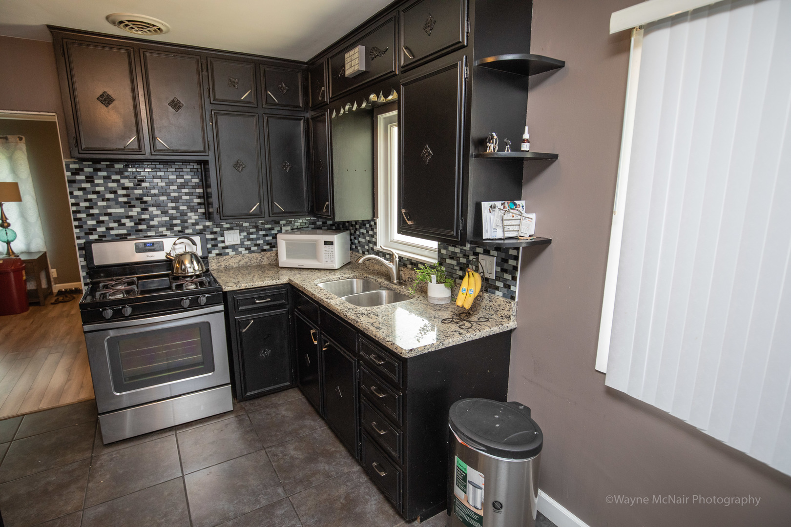 1610 Black Road Joliet, IL 60435 - Photo 9 of 25 a kitchen with stainless steel appliances granite countertop a sink stove and cabinets