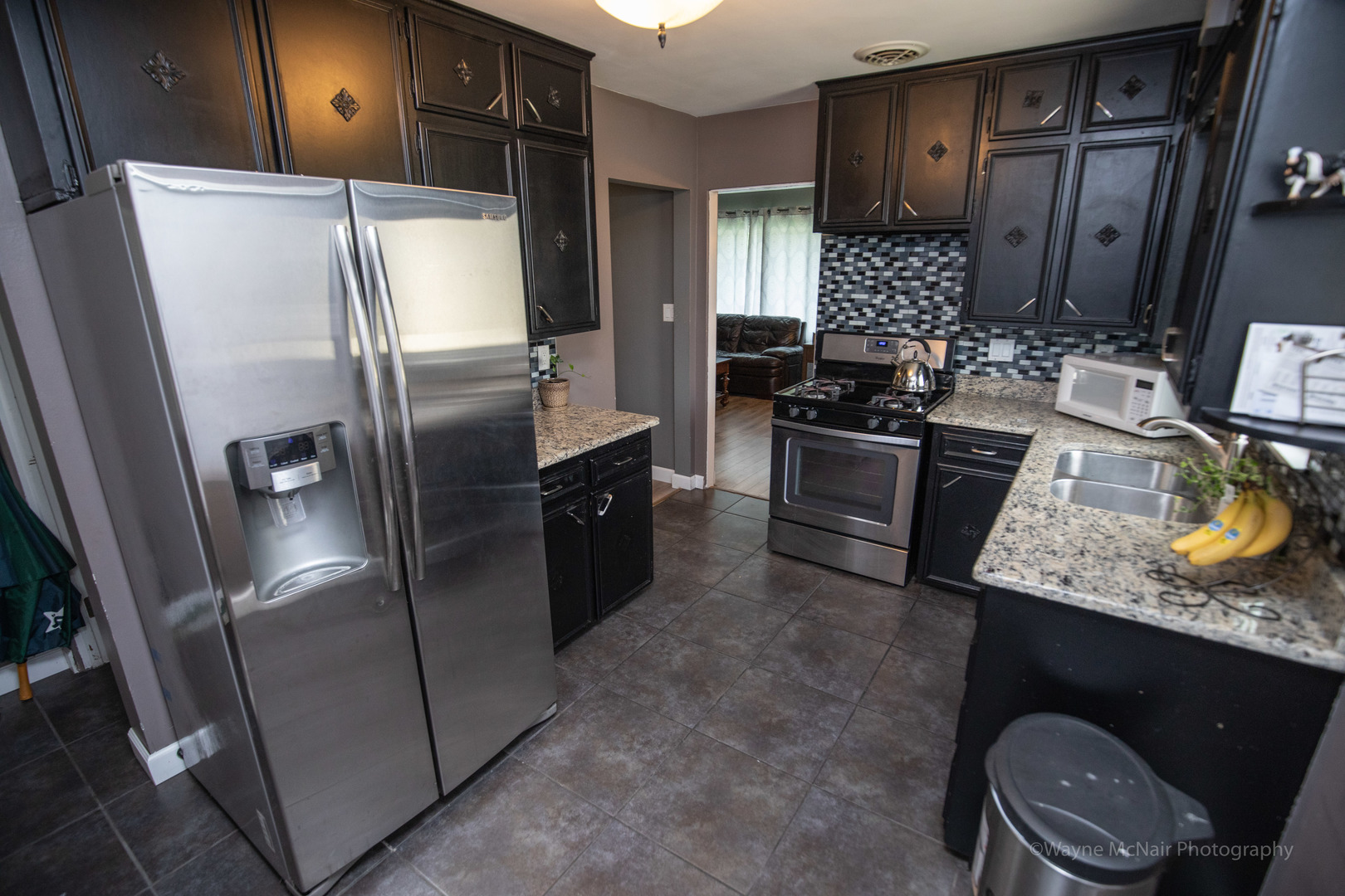 1610 Black Road Joliet, IL 60435 - Photo 10 of 25 a kitchen with stainless steel appliances granite countertop a refrigerator a stove and a sink