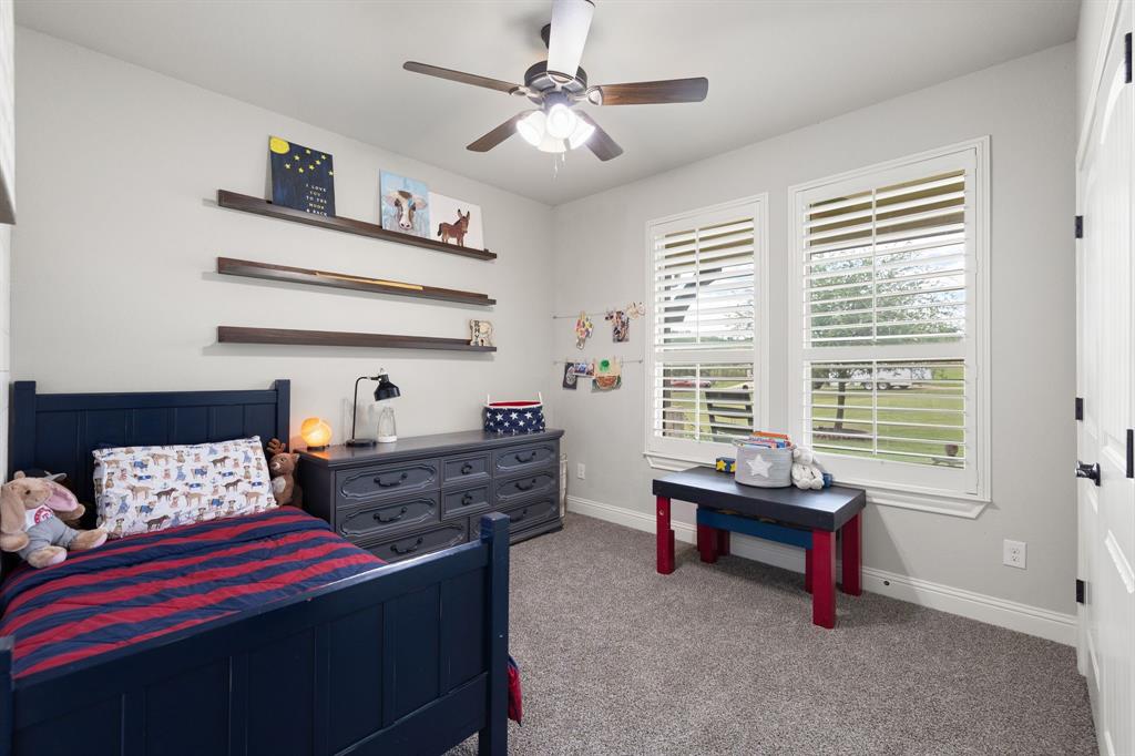 2103 Cash Point Court Granbury, TX 76049 - Photo 23 of 38 a bed room with a bed and a window