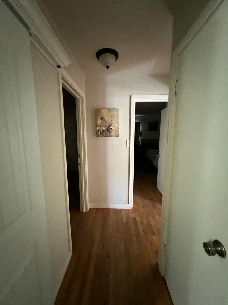 120 Southwest 10th Plainview, TX 79072 - Photo 13 of 27 a view of a hallway with wooden floor