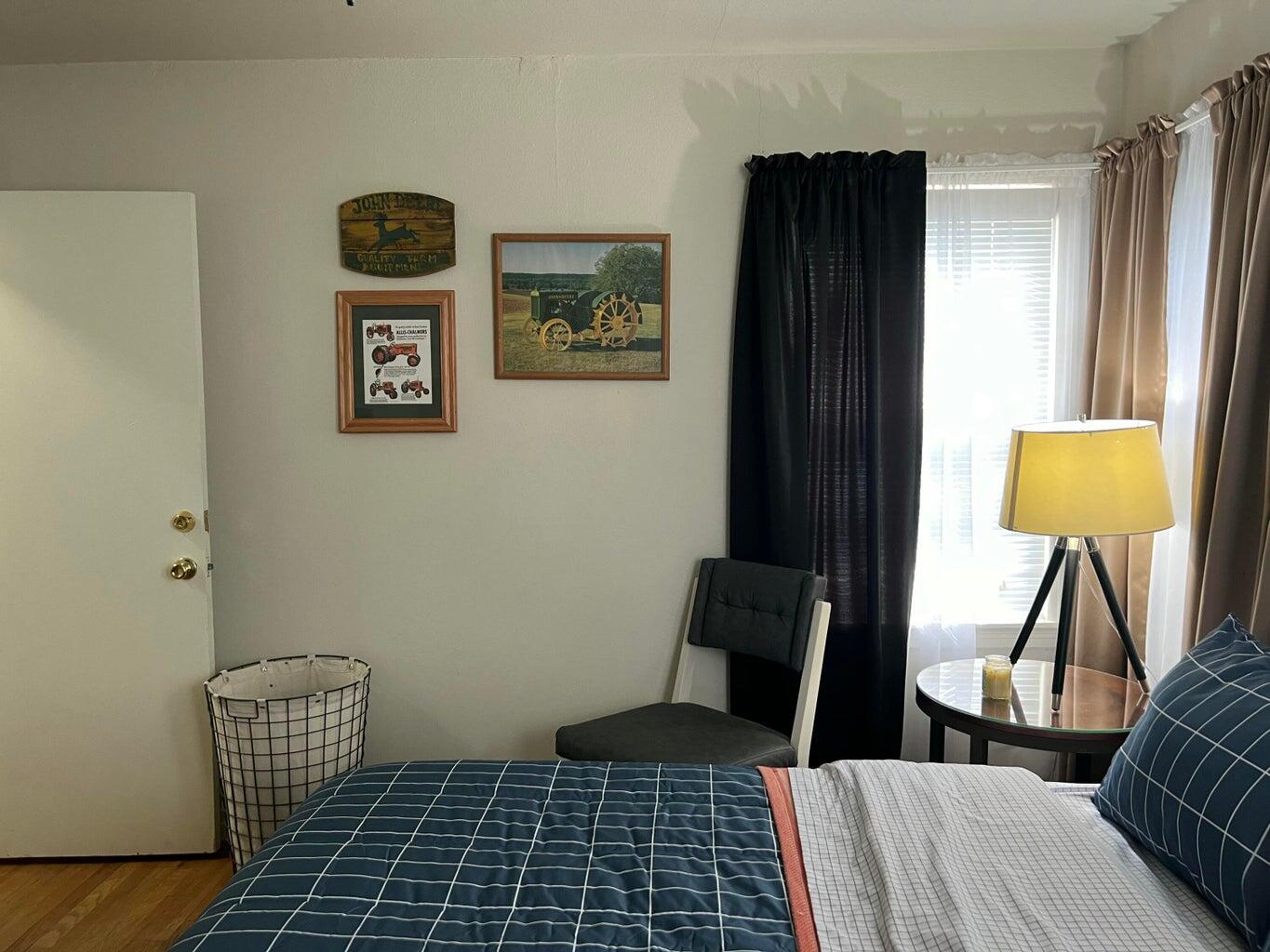 120 Southwest 10th Plainview, TX 79072 - Photo 19 of 27 a bedroom with a bed and a table in it