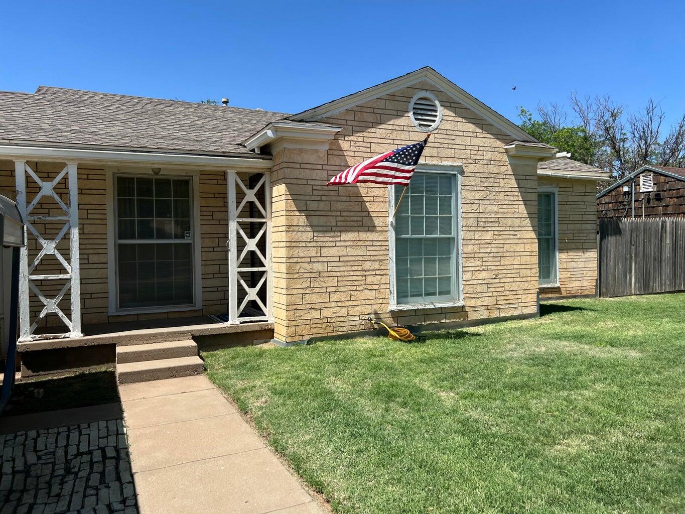 120 Southwest 10th Plainview, TX 79072 - Photo 2 of 27 a front view of a house with a yard