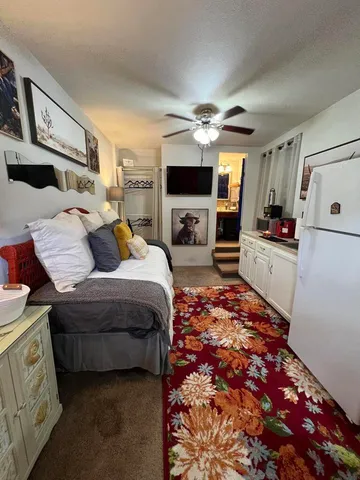 a view of living room with furniture and a window