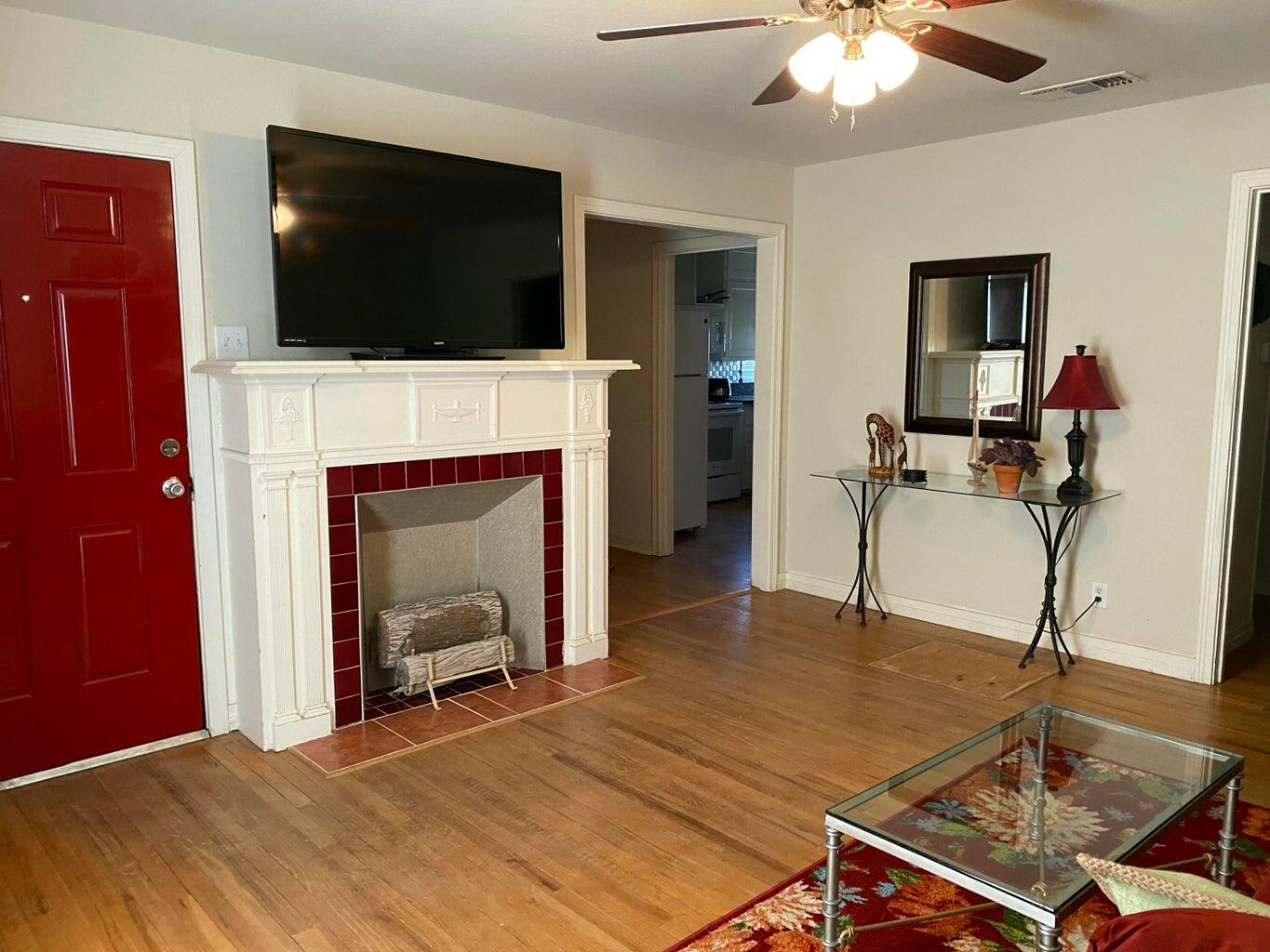 120 Southwest 10th Plainview, TX 79072 - Photo 5 of 27 a room with furniture and a fireplace