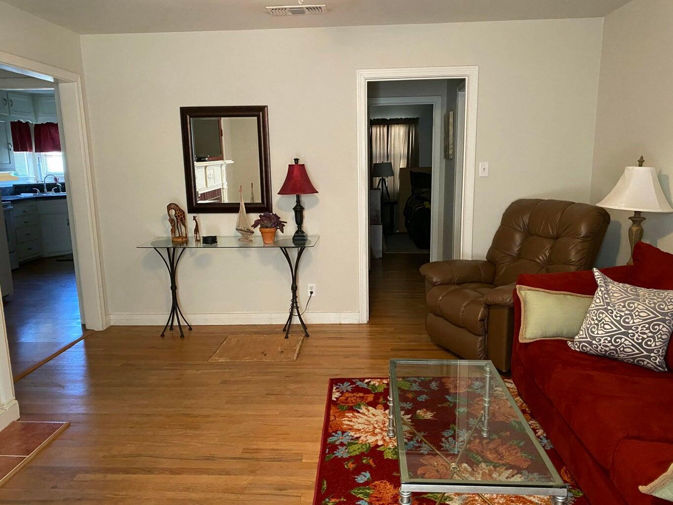 120 Southwest 10th Plainview, TX 79072 - Photo 6 of 27 a living room with furniture and a wooden floor